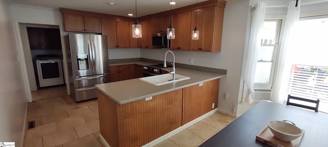 362 Green Hill Dr, Anderson, SC 29621 - kitchen featuring brown cabinets, stainless steel appliances, a sink, a wealth of natural light, and a peninsula