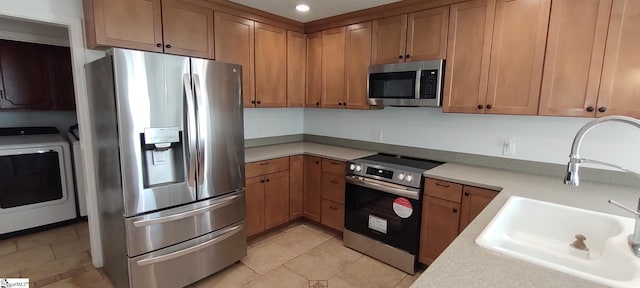 362 Green Hill Dr, Anderson, SC 29621 - kitchen with recessed lighting, stainless steel appliances, light countertops, a sink, and washer / clothes dryer