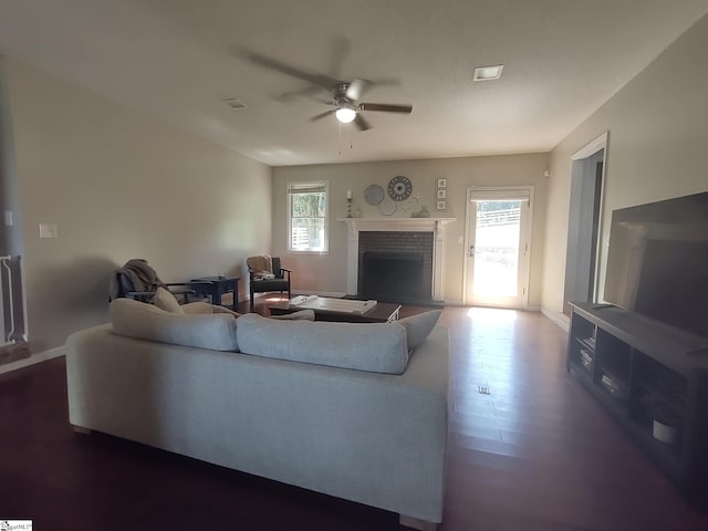 362 Green Hill Dr, Anderson, SC 29621 - living room featuring dark wood-style floors, visible vents, a ceiling fan, baseboards, and a fireplace