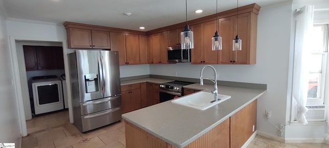 362 Green Hill Dr, Anderson, SC 29621 - kitchen with a sink, washer / dryer, light countertops, a peninsula, and appliances with stainless steel finishes