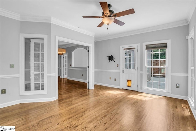 spare room with crown molding, ceiling fan, and light hardwood / wood-style floors