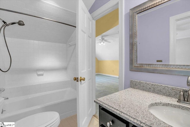 full bathroom featuring vanity, toilet, lofted ceiling, ceiling fan, and tiled shower / bath combo