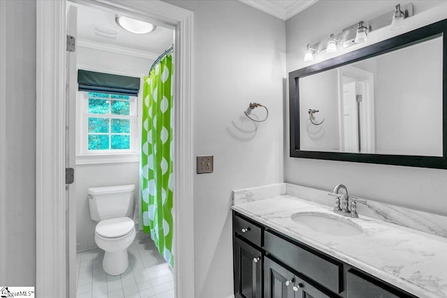 bathroom featuring crown molding, vanity, toilet, and tile patterned flooring