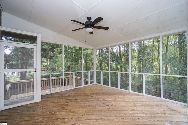 unfurnished sunroom featuring ceiling fan and vaulted ceiling