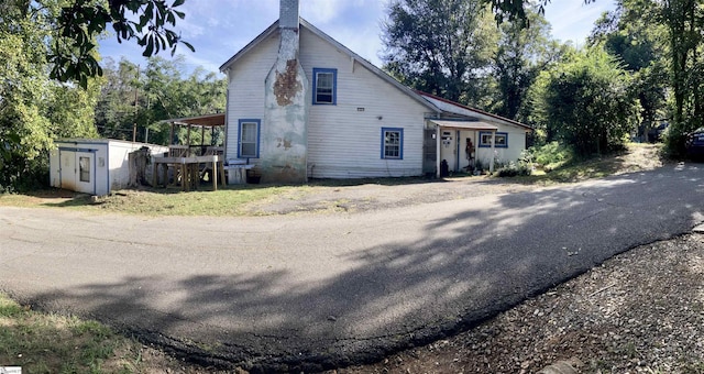 view of front of property featuring a chimney