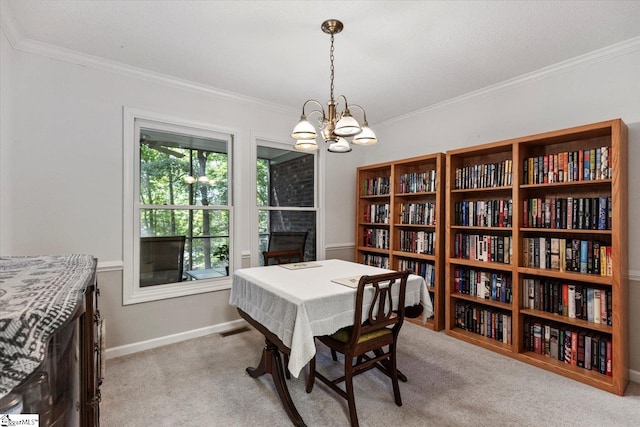 carpeted dining room with a textured ceiling, crown molding, a notable chandelier, and a fireplace