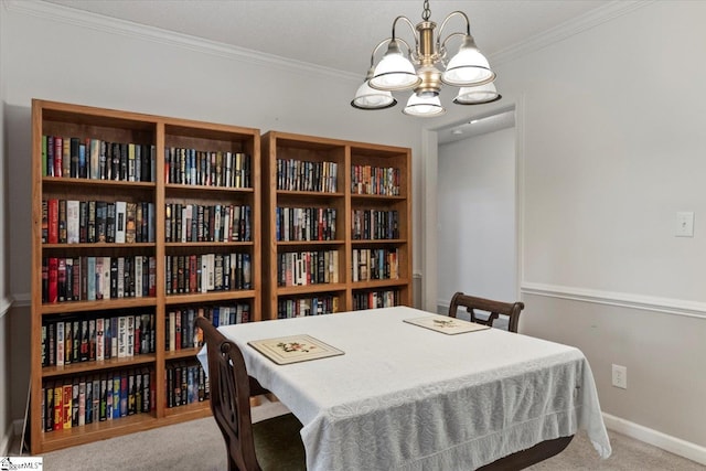 carpeted dining room with crown molding and a chandelier