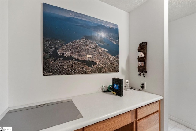 bathroom with vanity and a textured ceiling