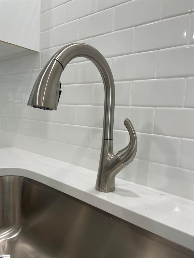 details with sink and decorative backsplash