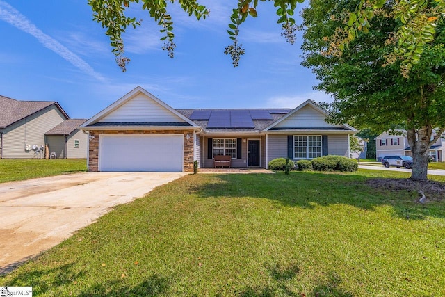 single story home featuring a front lawn, a garage, and solar panels