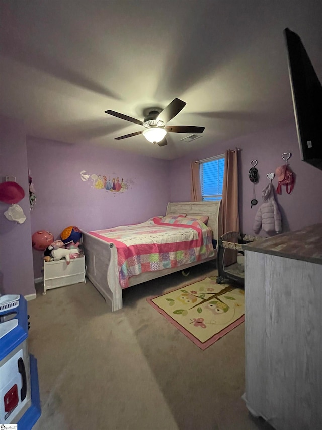 carpeted bedroom with ceiling fan