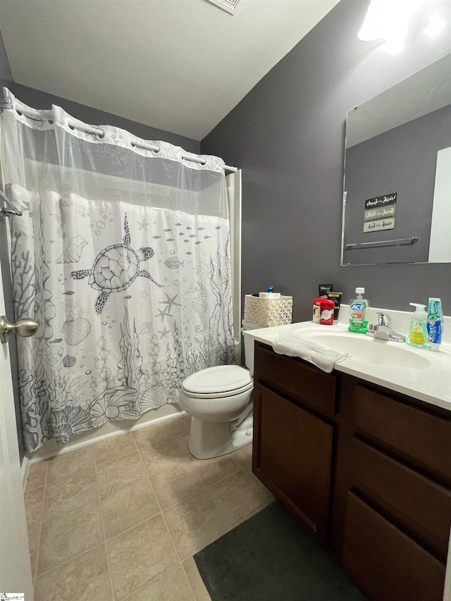 bathroom with vanity, tile patterned floors, and toilet