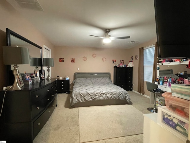 bedroom with light carpet and ceiling fan