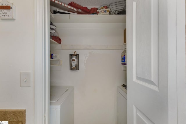 laundry area with washing machine and dryer