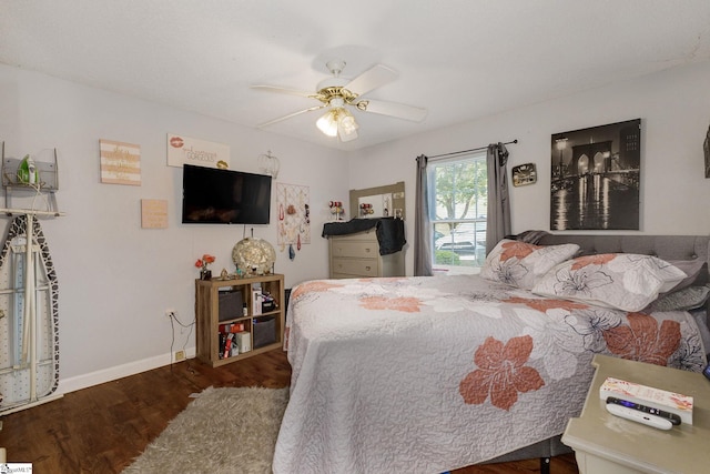 bedroom featuring dark hardwood / wood-style flooring and ceiling fan