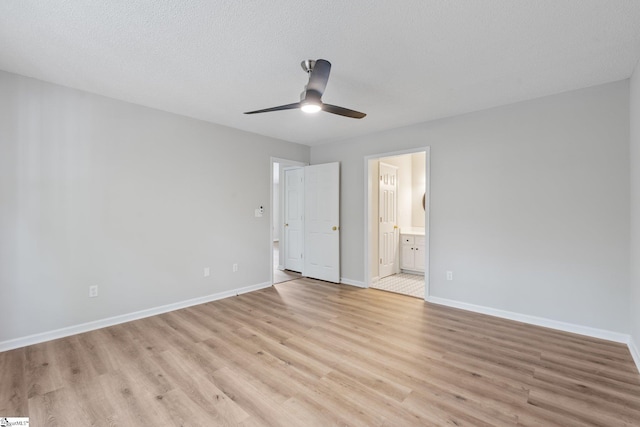5 Townes Creek Ct, Greenville, SC 29609 - unfurnished bedroom featuring light wood-type flooring, baseboards, a ceiling fan, and ensuite bath