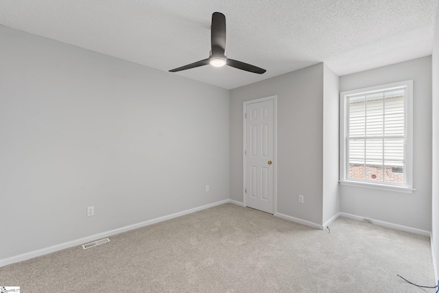 5 Townes Creek Ct, Greenville, SC 29609 - unfurnished bedroom featuring baseboards, a textured ceiling, visible vents, ceiling fan, and light colored carpet
