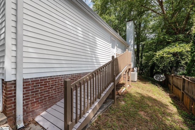 5 Townes Creek Ct, Greenville, SC 29609 - view of home's exterior with a chimney, fence, and central AC