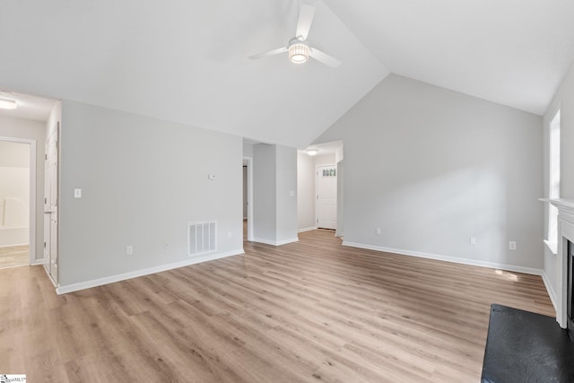 5 Townes Creek Ct, Greenville, SC 29609 - unfurnished living room with visible vents, ceiling fan, light wood-style floors, vaulted ceiling, and a fireplace with flush hearth