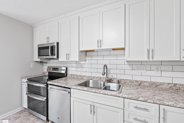 5 Townes Creek Ct, Greenville, SC 29609 - kitchen featuring stainless steel appliances, white cabinets, a sink, and backsplash