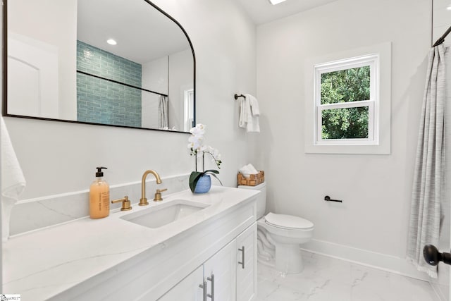 bathroom with vanity, toilet, and walk in shower