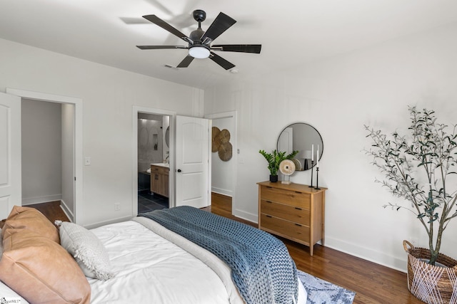 bedroom featuring dark wood-type flooring, ceiling fan, and ensuite bathroom