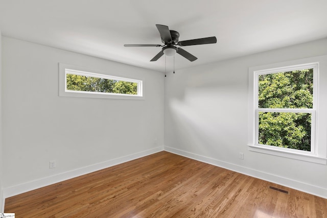 spare room with ceiling fan and light hardwood / wood-style flooring