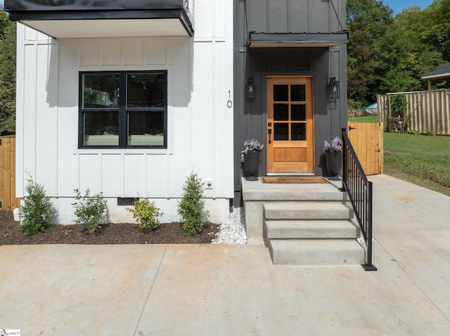 property entrance featuring a patio area