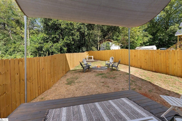 view of yard with an outdoor fire pit