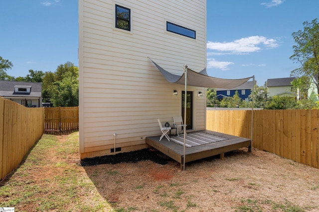 back of house with a wooden deck