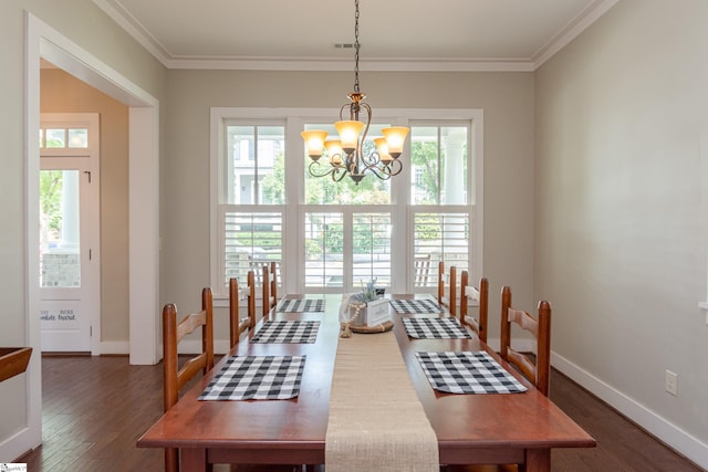 dining area with a notable chandelier, dark hardwood / wood-style floors, and crown molding