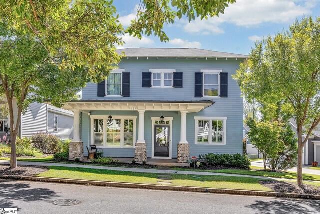 property entrance featuring covered porch