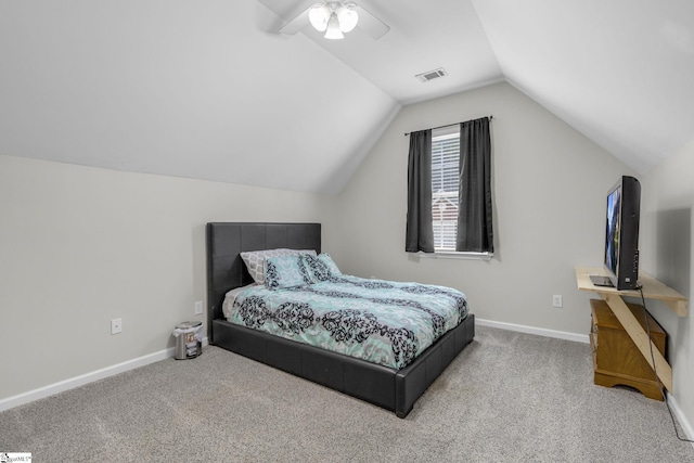 carpeted bedroom with lofted ceiling and ceiling fan