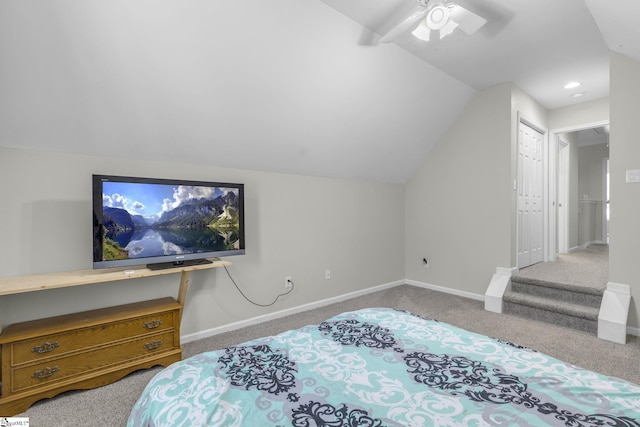 bedroom featuring carpet flooring, a closet, ceiling fan, and vaulted ceiling