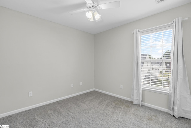 carpeted empty room featuring ceiling fan