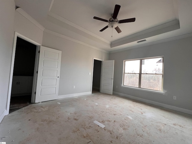 unfurnished bedroom featuring visible vents, baseboards, a raised ceiling, ceiling fan, and ornamental molding