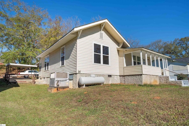 view of home's exterior featuring a lawn