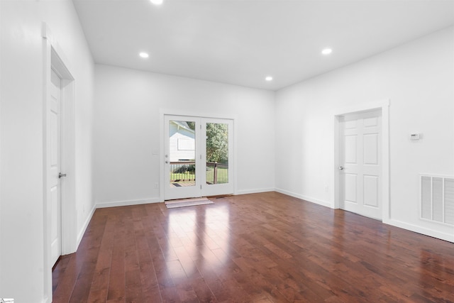 unfurnished room featuring dark wood-style floors, recessed lighting, visible vents, and baseboards