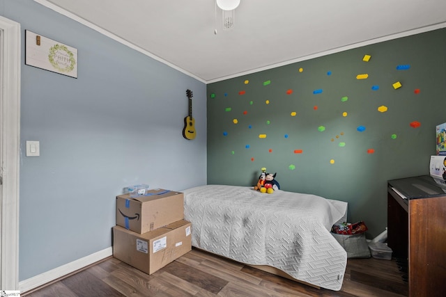 bedroom featuring dark hardwood / wood-style flooring and ornamental molding