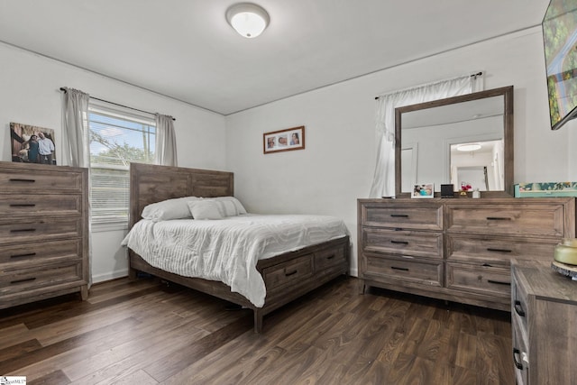 bedroom with dark wood-type flooring