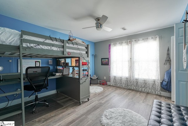 bedroom featuring wood-type flooring and ceiling fan