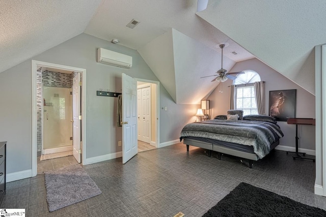 bedroom featuring vaulted ceiling, a textured ceiling, a wall unit AC, and ceiling fan