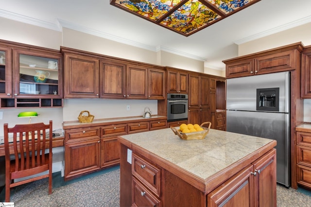 kitchen featuring ornamental molding, stainless steel appliances, and a kitchen island