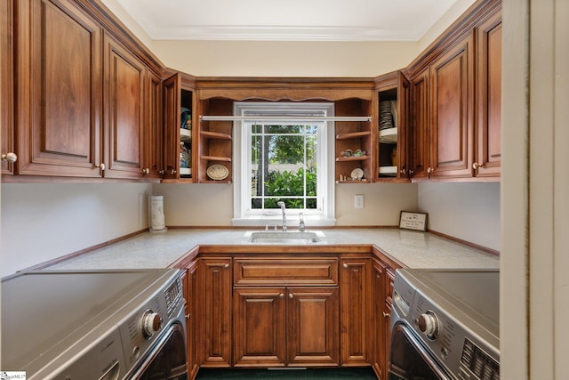 kitchen with crown molding, stainless steel range oven, and sink