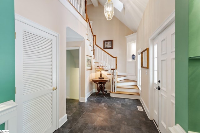 entryway with high vaulted ceiling