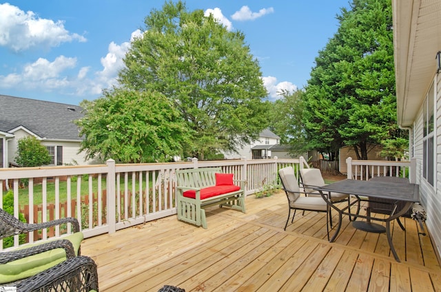 wooden deck featuring outdoor dining space