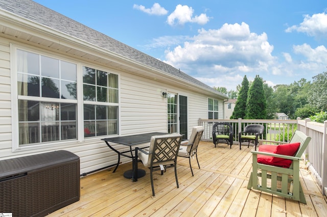 wooden deck with outdoor dining area