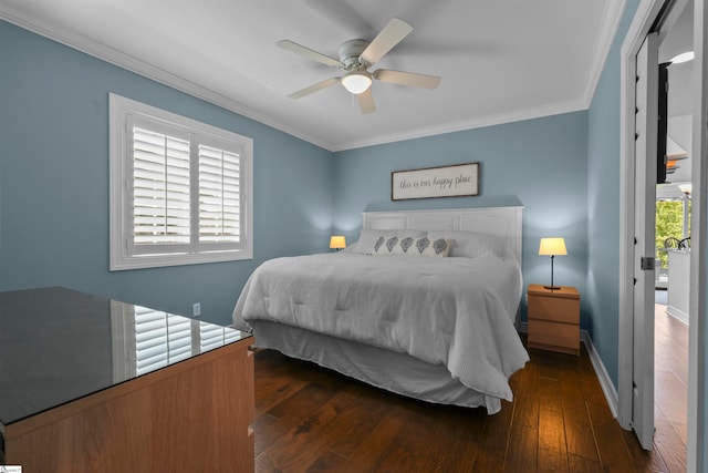 bedroom with ceiling fan, dark hardwood / wood-style floors, and ornamental molding