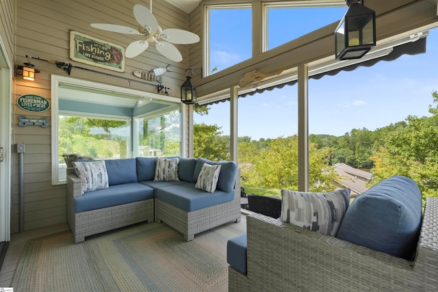 sunroom / solarium with ceiling fan and vaulted ceiling