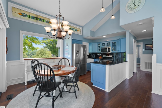 dining area featuring crown molding, dark wood-type flooring, high vaulted ceiling, and a chandelier